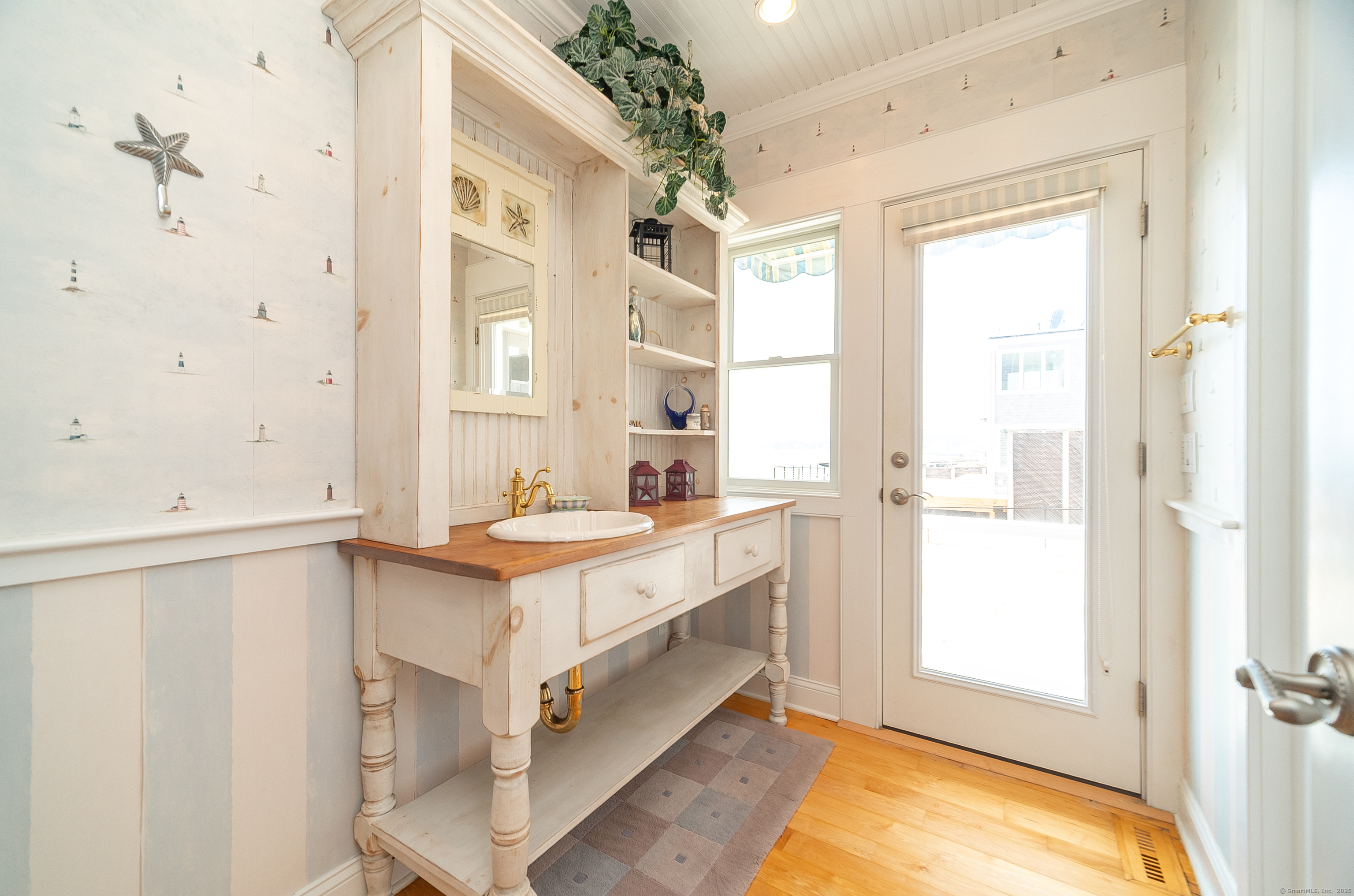 167 Shore Road Clinton, CT 06413 - Photo 14 of 40 First floor full bathroom that has access to outside.