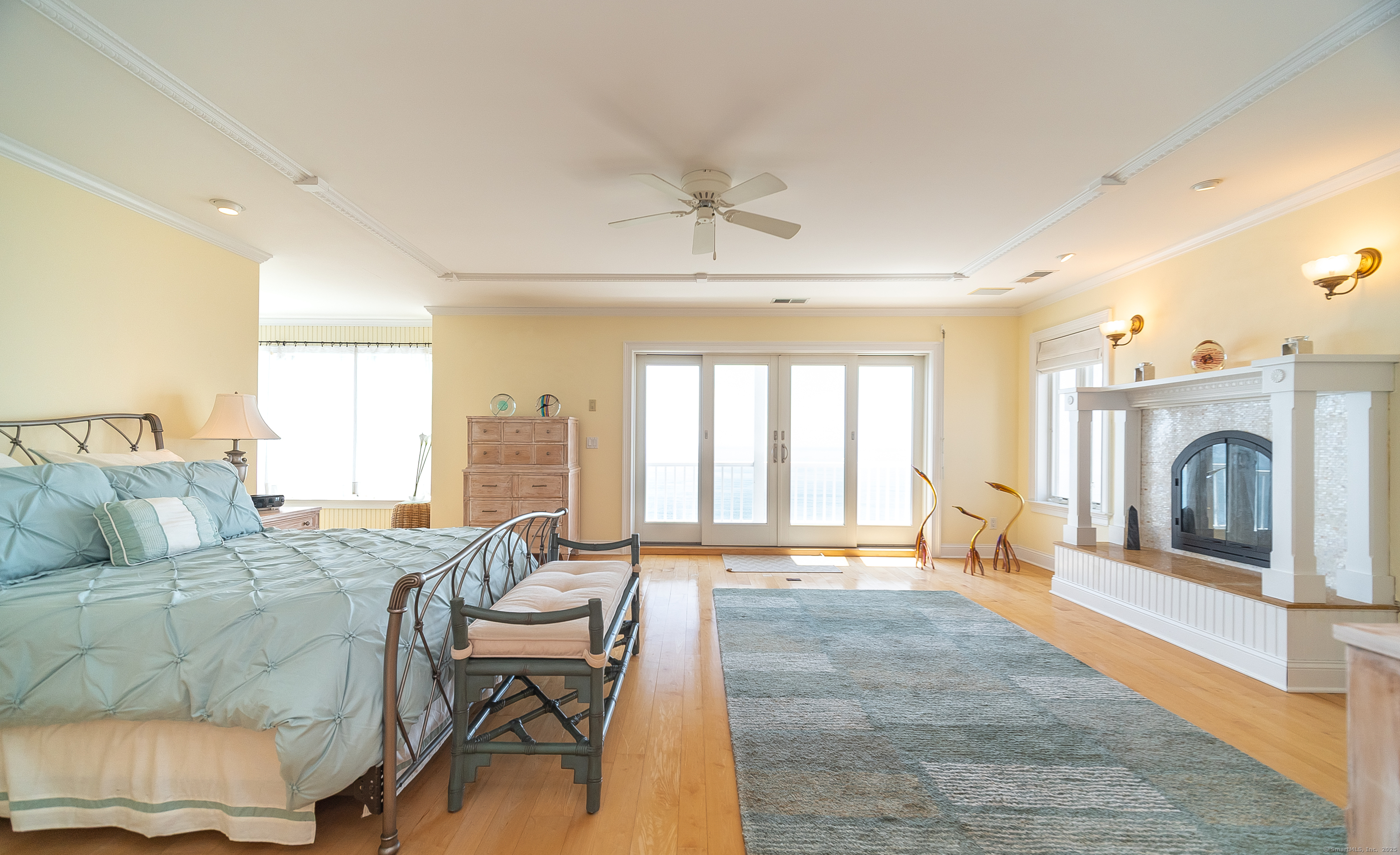 167 Shore Road Clinton, CT 06413 - Photo 18 of 40 Primary bedroom has a propane fireplace and sliding doors out to your own private balcony.