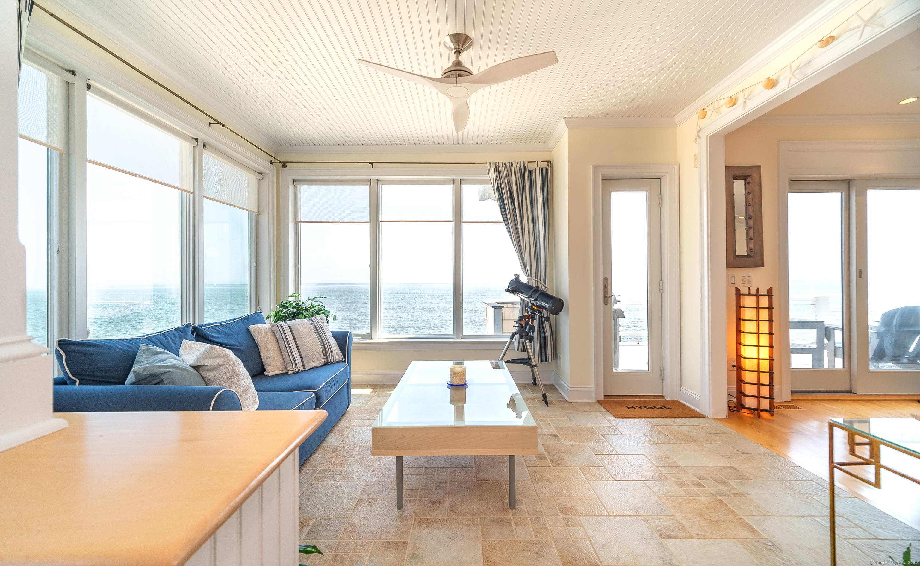 167 Shore Road Clinton, CT 06413 - Photo 4 of 40 Sitting area with radiant in-floor heating and waterviews.