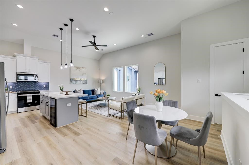 846 Elkhart Street, Unit E Houston, TX 77091 - Photo 7 of 24 a living room with fireplace furniture and a wooden floor