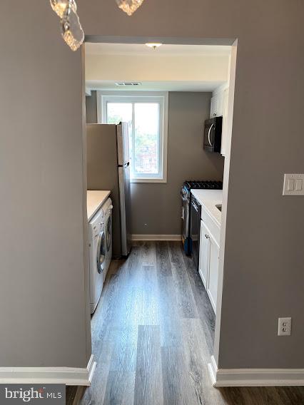 12 Halley Place Southeast, Unit 101 Washington, DC 20032 - Photo 7 of 19 Enter kitchen