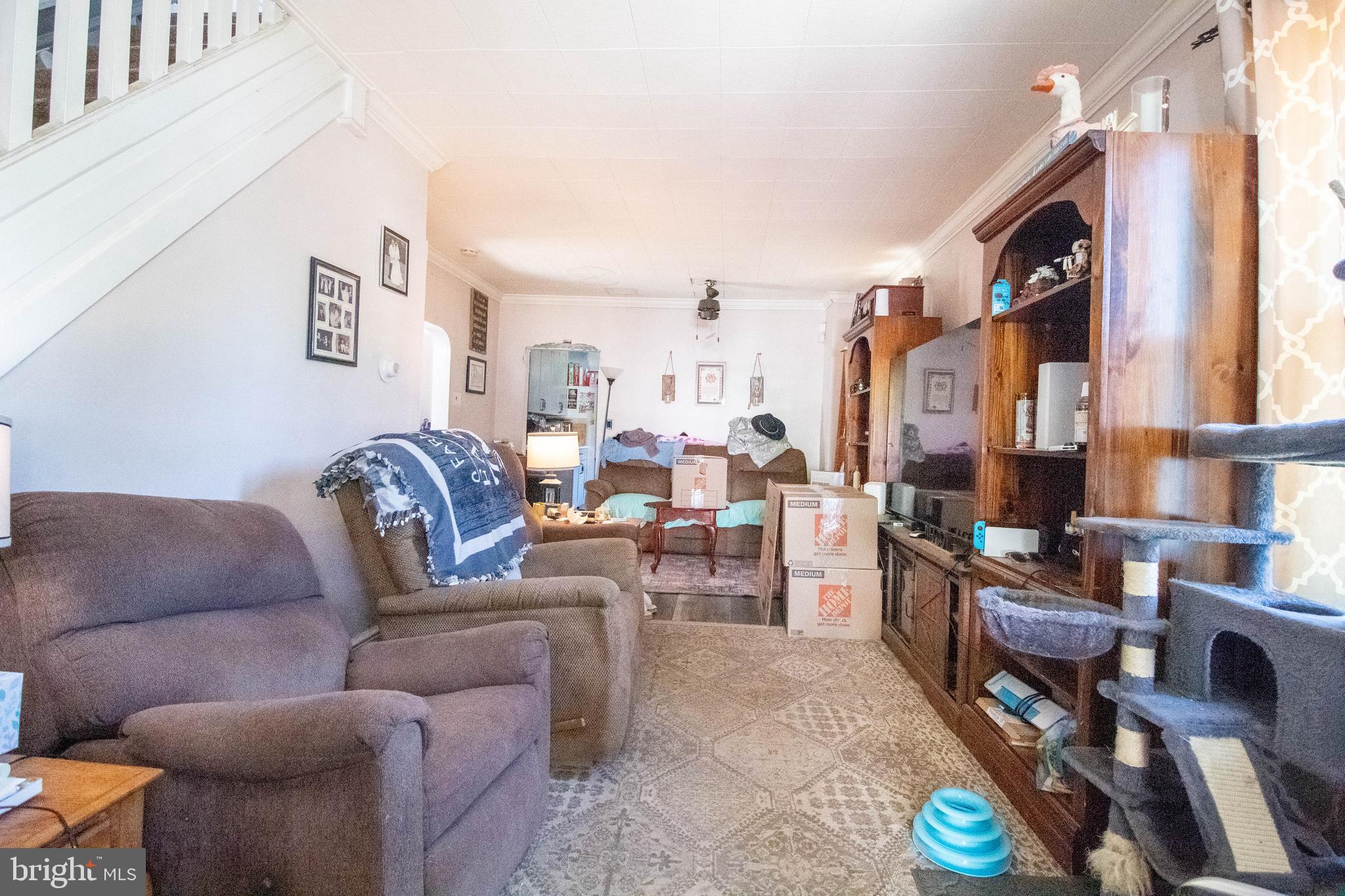 100 Grant Street Riverside, NJ 08075 - Photo 16 of 34 a living room with furniture and a fireplace