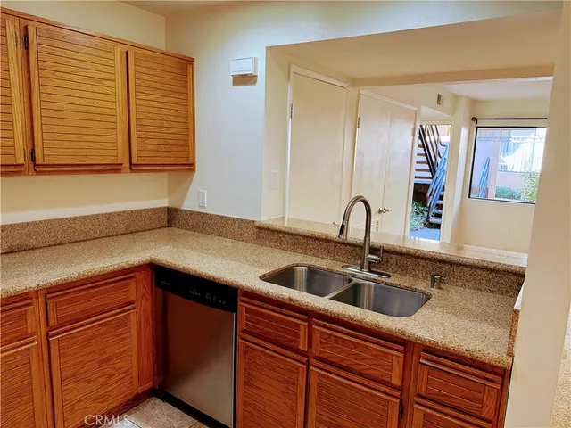 a kitchen with a sink and cabinets