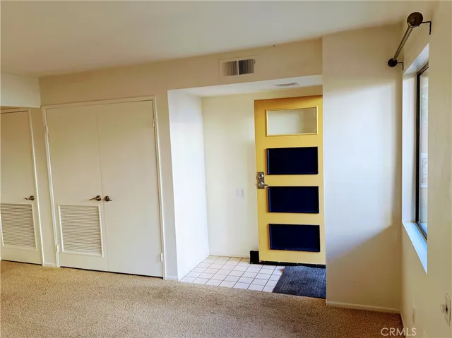 a view of room with walk in closet and window