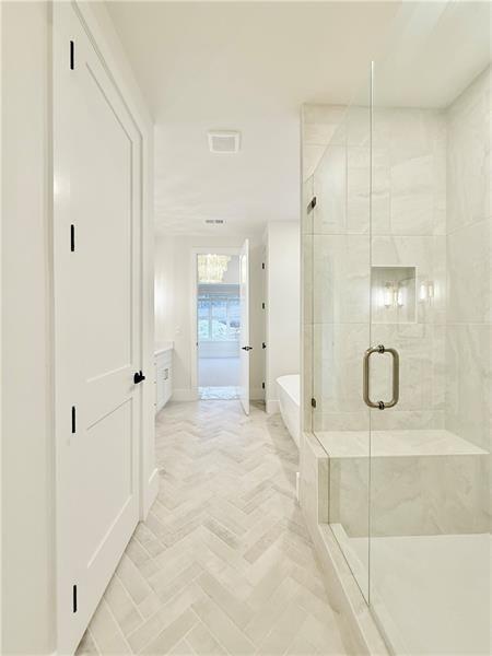 122 Palisade Drive Rydal, GA 30171 - Photo 39 of 54 a bathroom with a glass shower door mirror and window