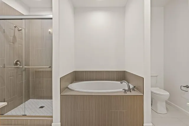 an aerial view of residential building with outdoor space and trees