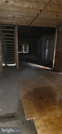 a view of an empty room with a fireplace
