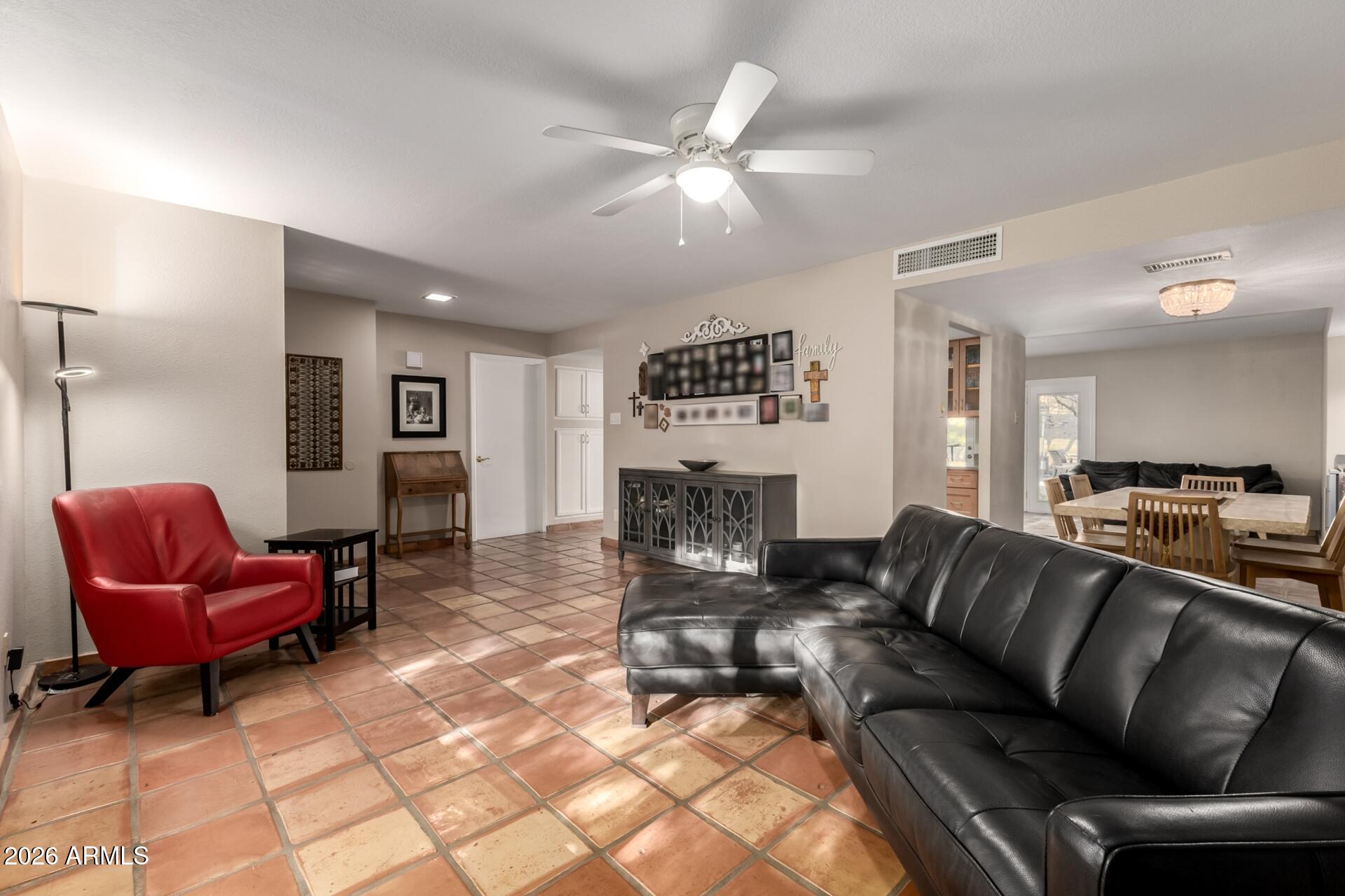 7657 North 22nd Street Phoenix, AZ 85020 - Photo 16 of 76 a living room with furniture and a chandelier