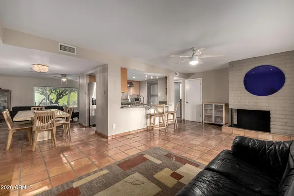 a view of a livingroom with furniture and a window