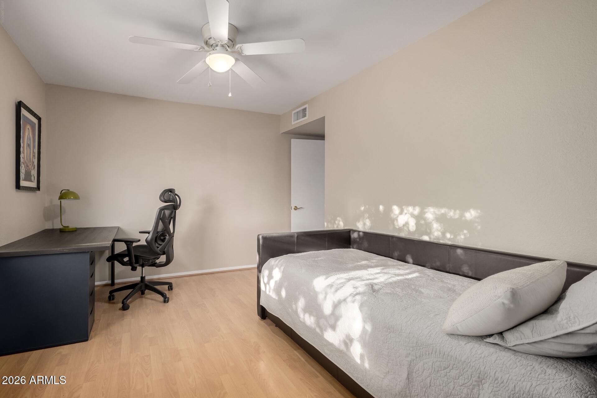 7657 North 22nd Street Phoenix, AZ 85020 - Photo 35 of 76 a bedroom with a bed and a chair