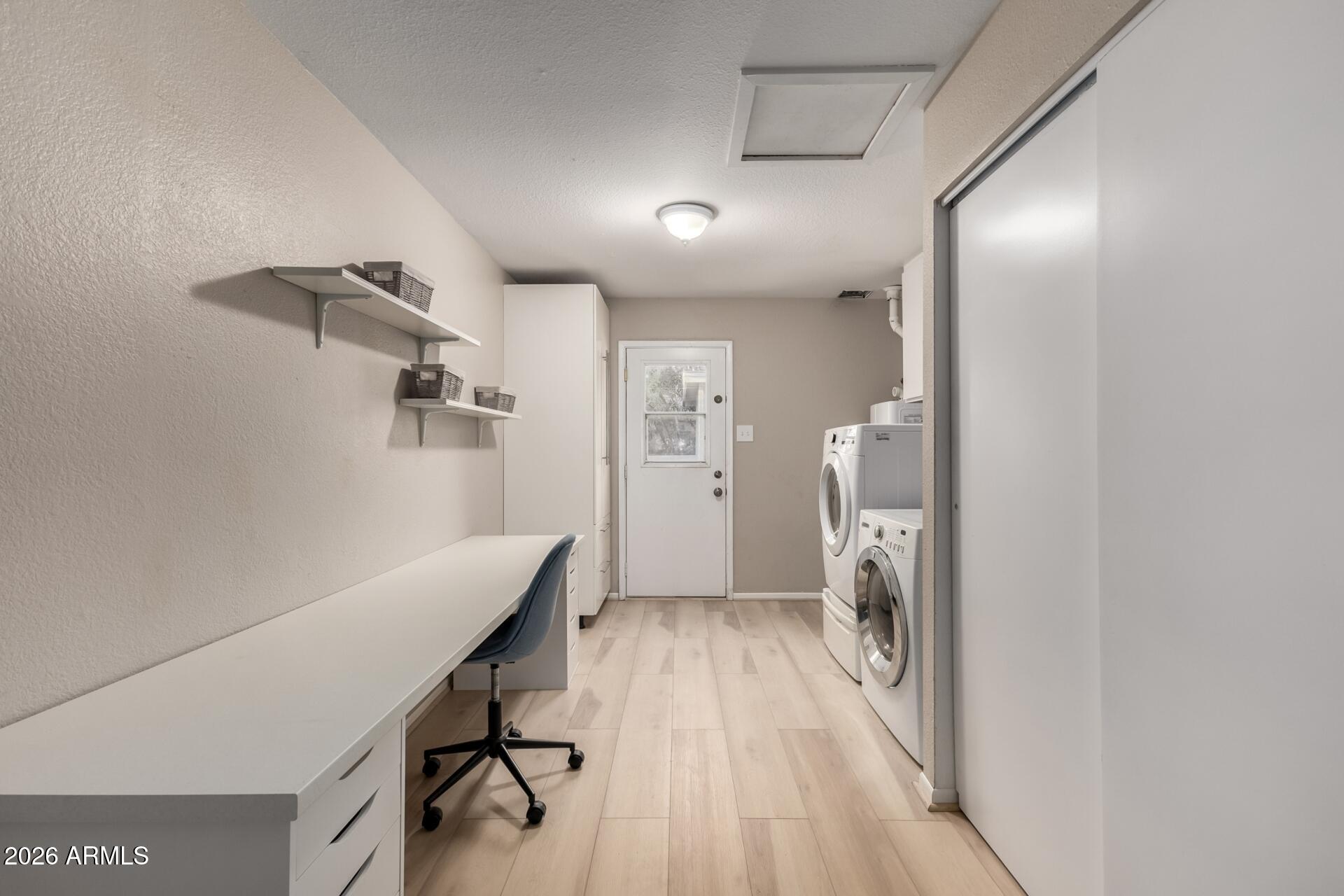 7657 North 22nd Street Phoenix, AZ 85020 - Photo 36 of 76 a view of a hallway with wooden floor and a livingroom