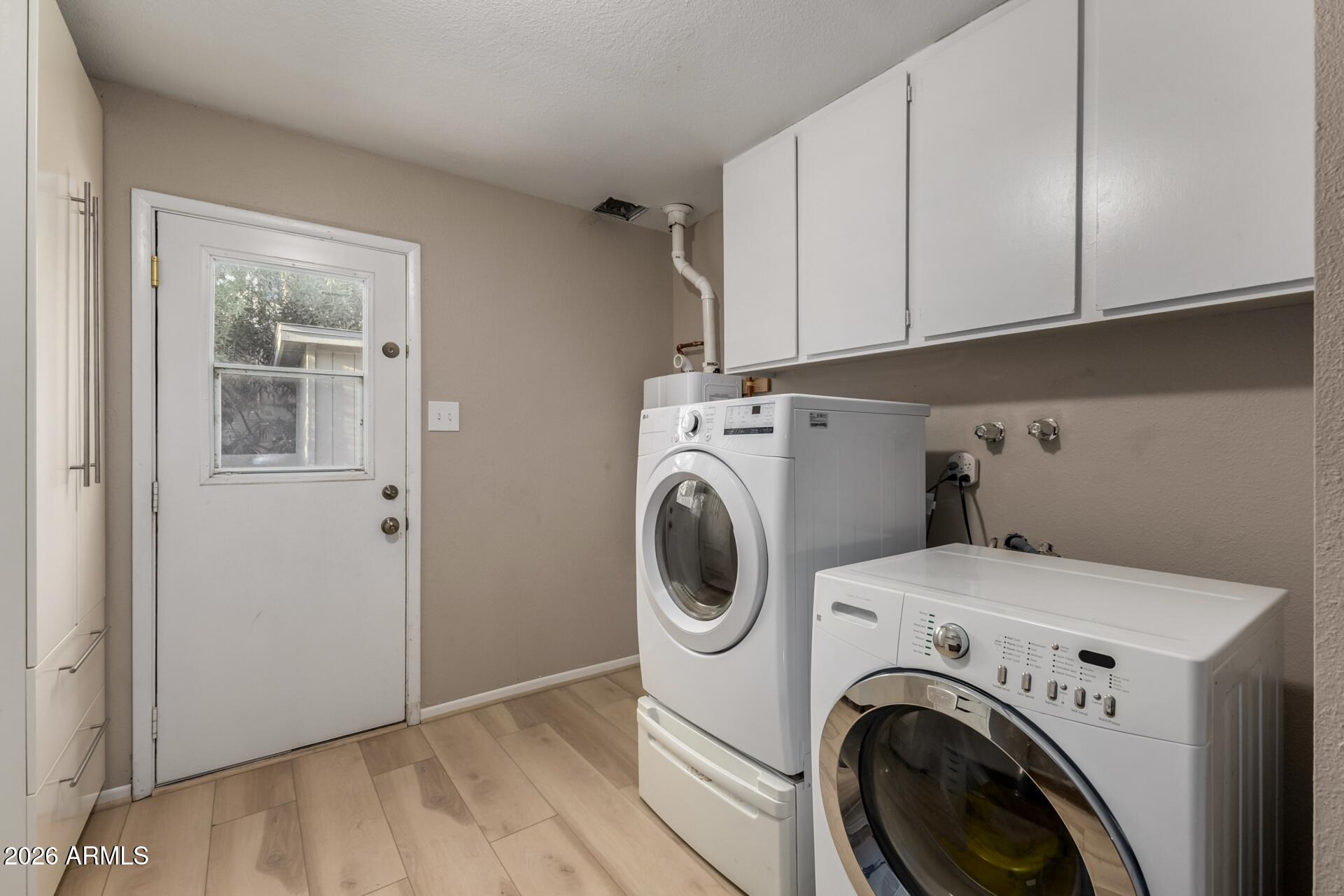7657 North 22nd Street Phoenix, AZ 85020 - Photo 37 of 76 a view of storage and utility room with washer and dryer