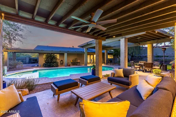 a outdoor space with patio the couches and a dining table with the garden view