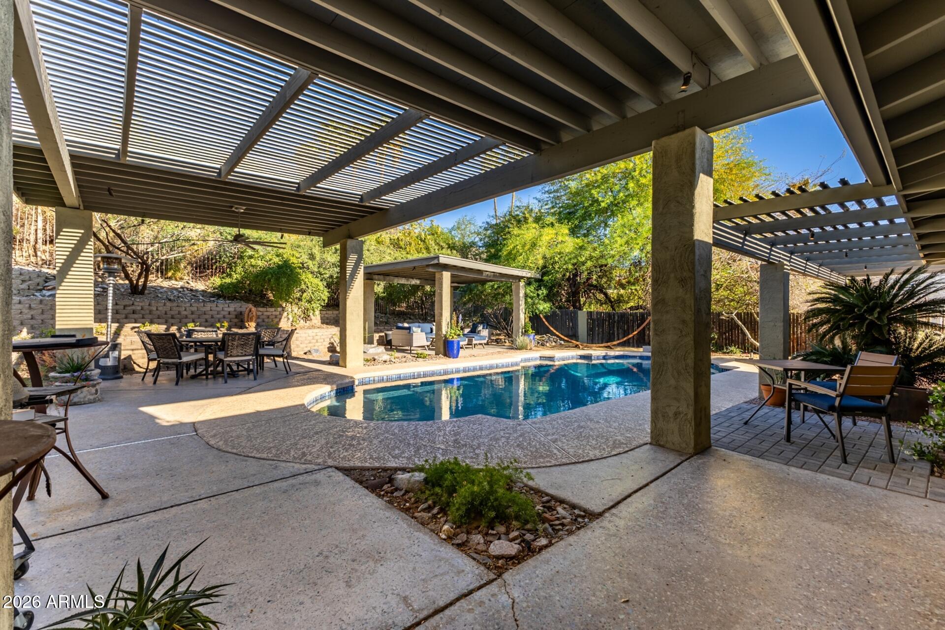 7657 North 22nd Street Phoenix, AZ 85020 - Photo 44 of 76 a view of a porch with furniture and a yard