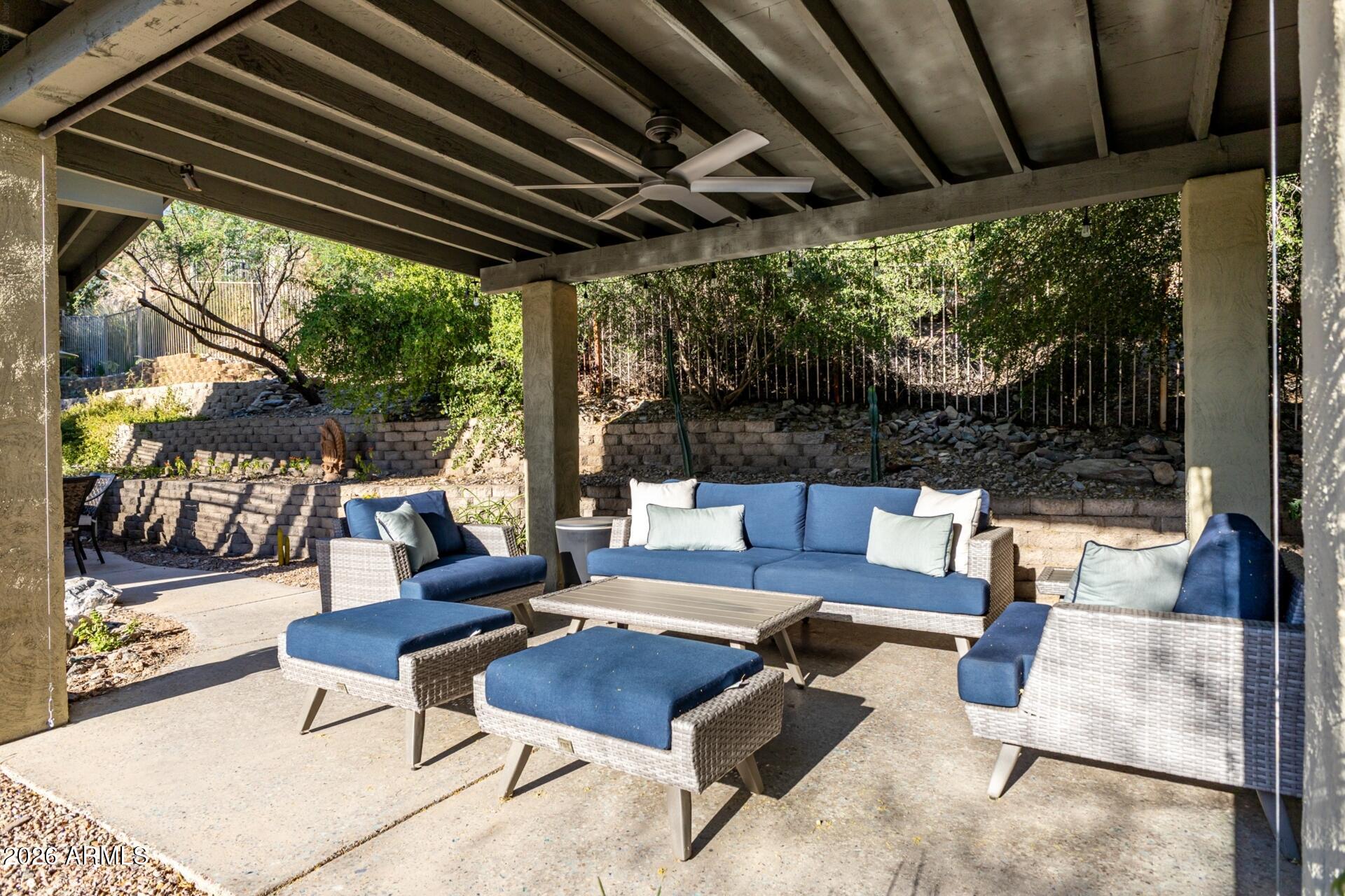 7657 North 22nd Street Phoenix, AZ 85020 - Photo 49 of 76 a outdoor space with patio the couches and a dining table with the garden view