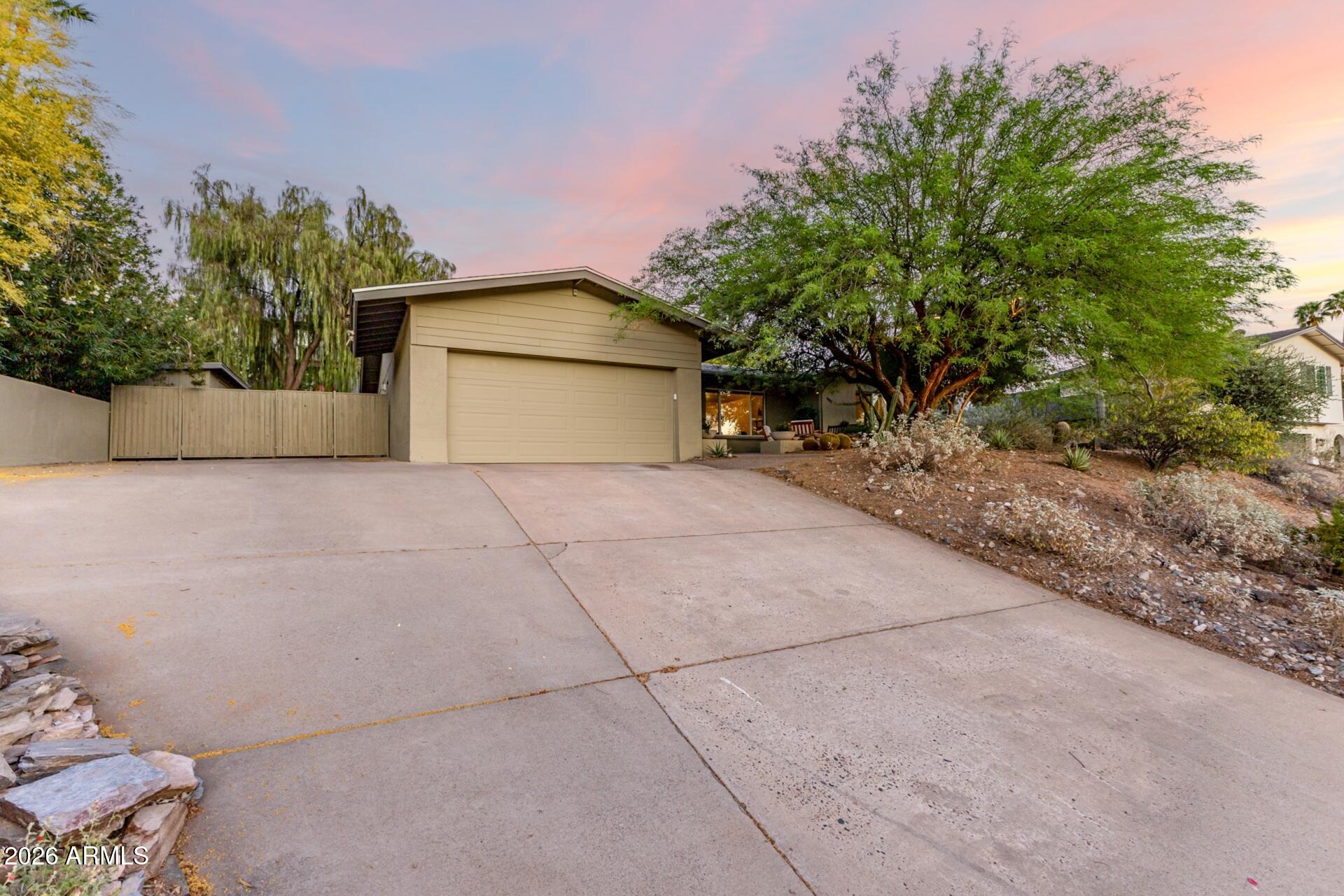 7657 North 22nd Street Phoenix, AZ 85020 - Photo 4 of 76 a view of a house with a yard and garage