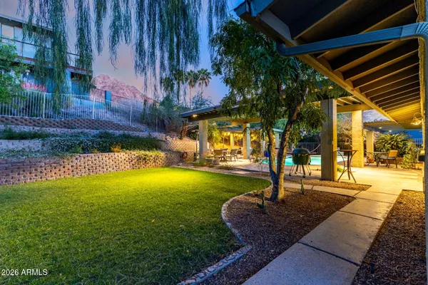 an outdoor space with pool and furniture