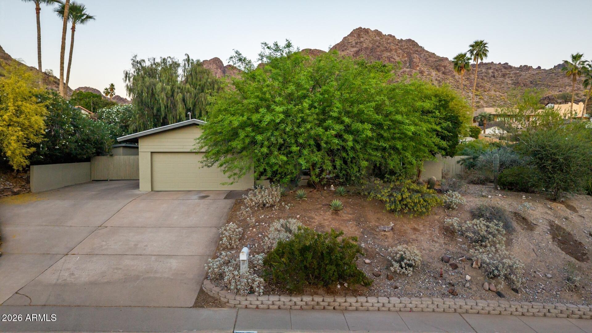 7657 North 22nd Street Phoenix, AZ 85020 - Photo 74 of 76 a view of a house with a yard and garage