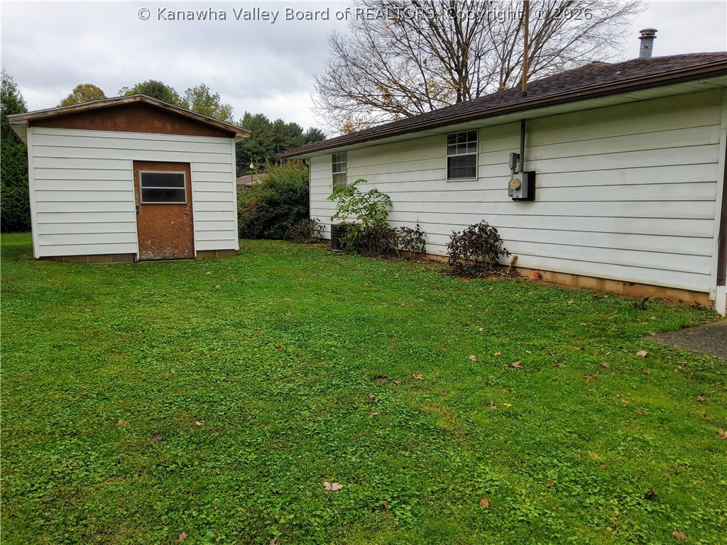 472 Staffhouse Road Point Pleasant, WV 25550 - Photo 4 of 36 LEFT YARD W/STORAGE BUILDING