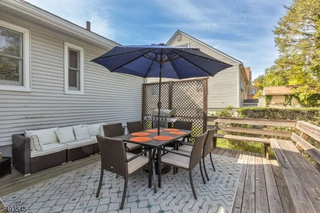 a patio with a table and chairs