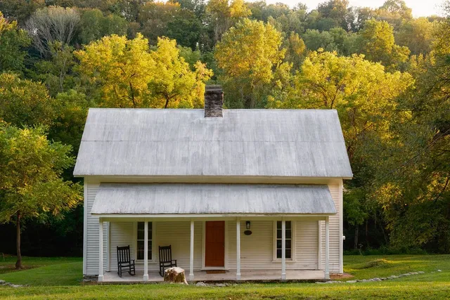 a kitchen with a refrigerator and a stove