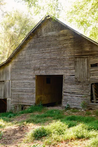 an aerial view of house with yard