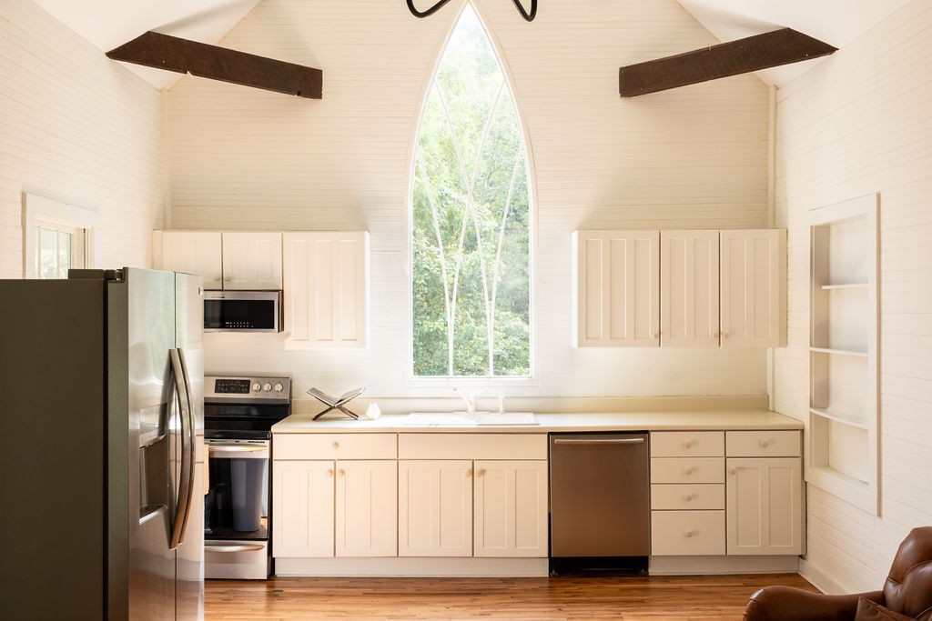 3685 Martin Ervin Road Santa Fe, TN 38482 - Photo 5 of 99 a kitchen with a refrigerator and a stove