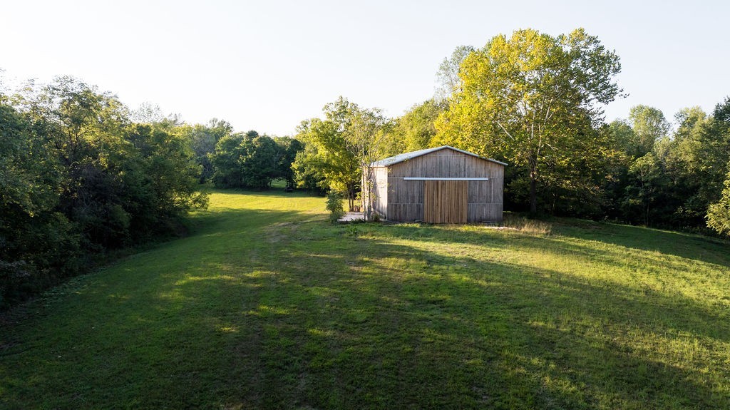 3685 Martin Ervin Road Santa Fe, TN 38482 - Photo 66 of 99 a view of a large garden with large trees and a small yard