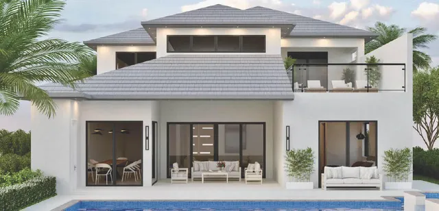 a front view of a house with glass windows and furniture