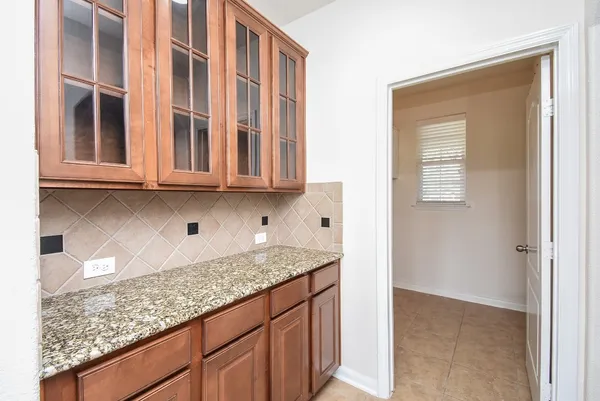 a kitchen with granite countertop white cabinets and granite counter tops