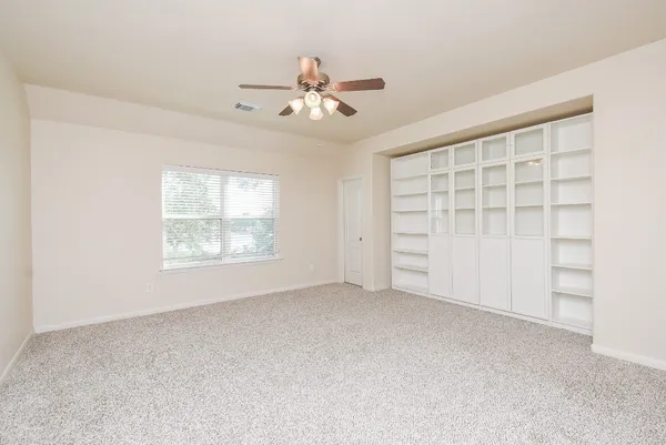 a view of an empty room with a window