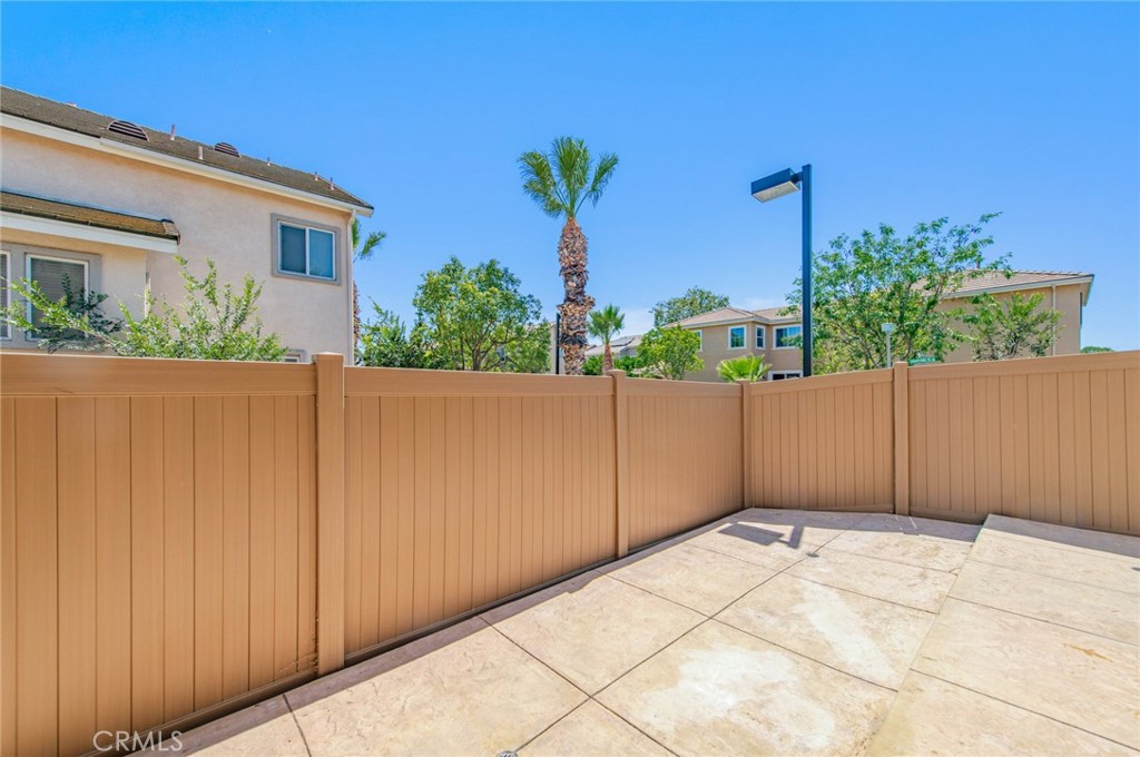4947 Plumtree Court Riverside, CA 92504 - Photo 20 of 46 Low-maintenance paved back yard & side yard