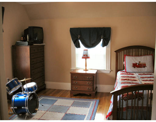 22 Middlesex Road Watertown, MA 02472 - Photo 5 of 7 a bedroom with furniture and a window