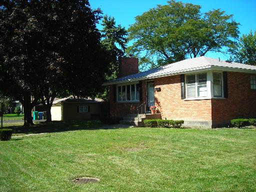 402 High Ridge Road Hillside, IL 60162 - Photo 1 of 1 a front view of a house with a yard and trees