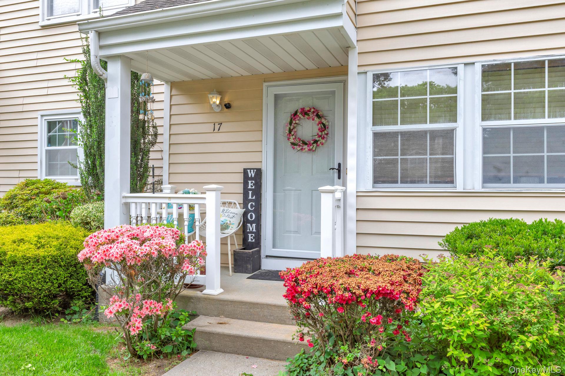 17 Stone Commons Yaphank, NY 11980 - Photo 6 of 31 Inviting front porch with a white railing and concrete steps