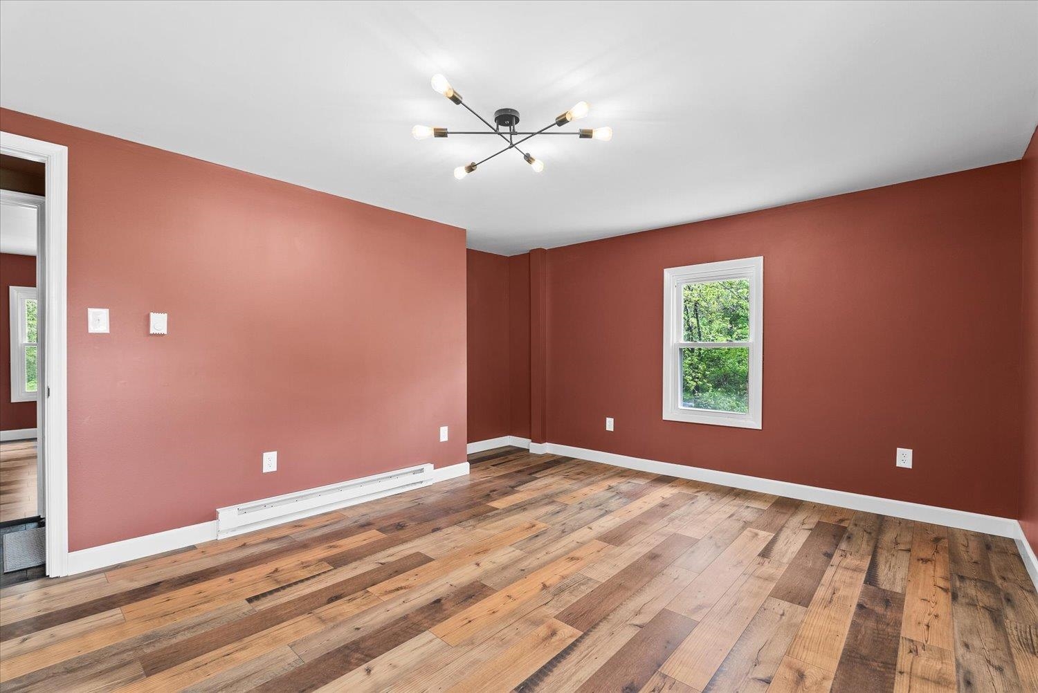 788 Hundley Distillery Road Churchville, VA 24421 - Photo 33 of 56 a view of an empty room with window and wooden floor