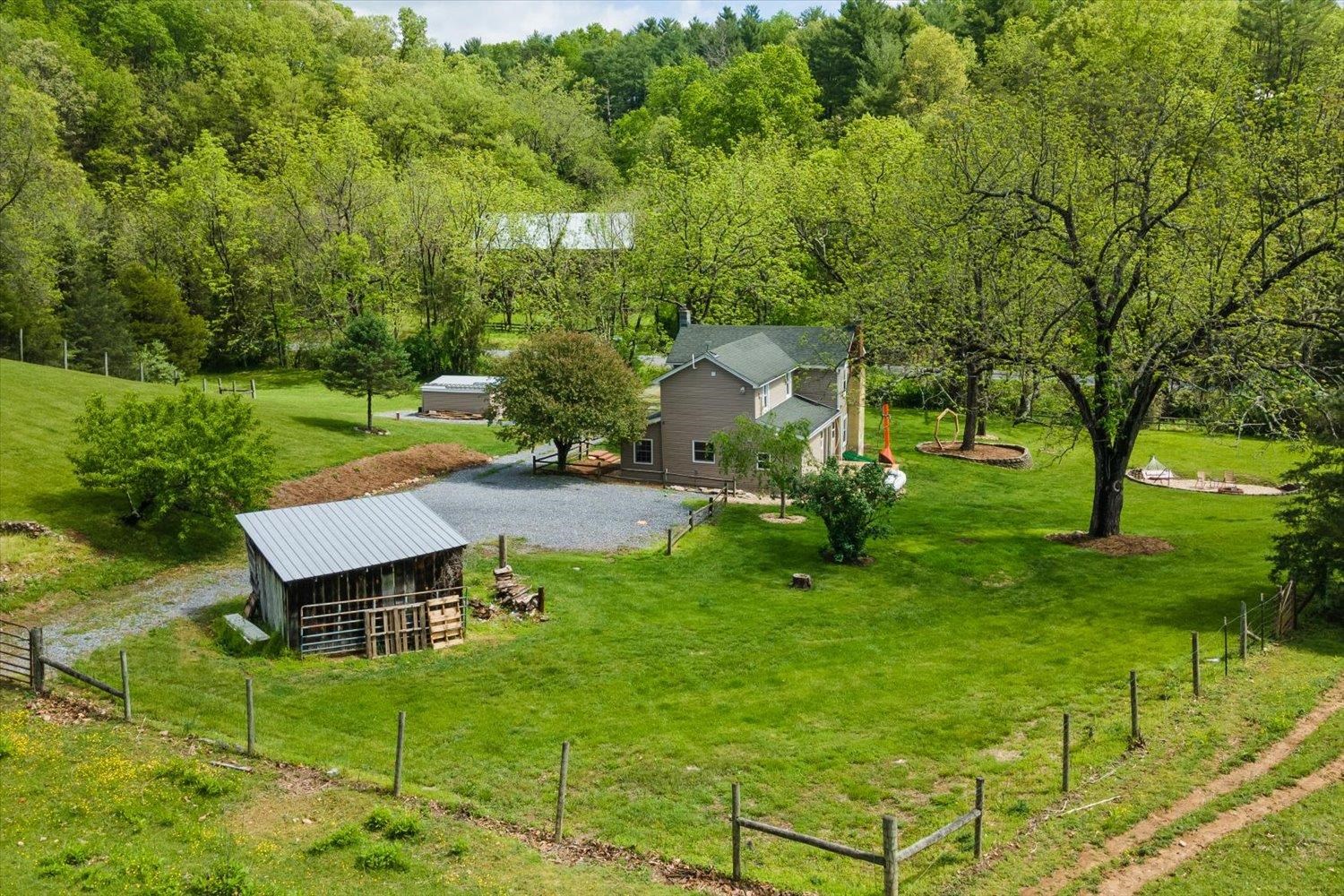 788 Hundley Distillery Road Churchville, VA 24421 - Photo 48 of 56 a view of a backyard with table and chairs with a swing