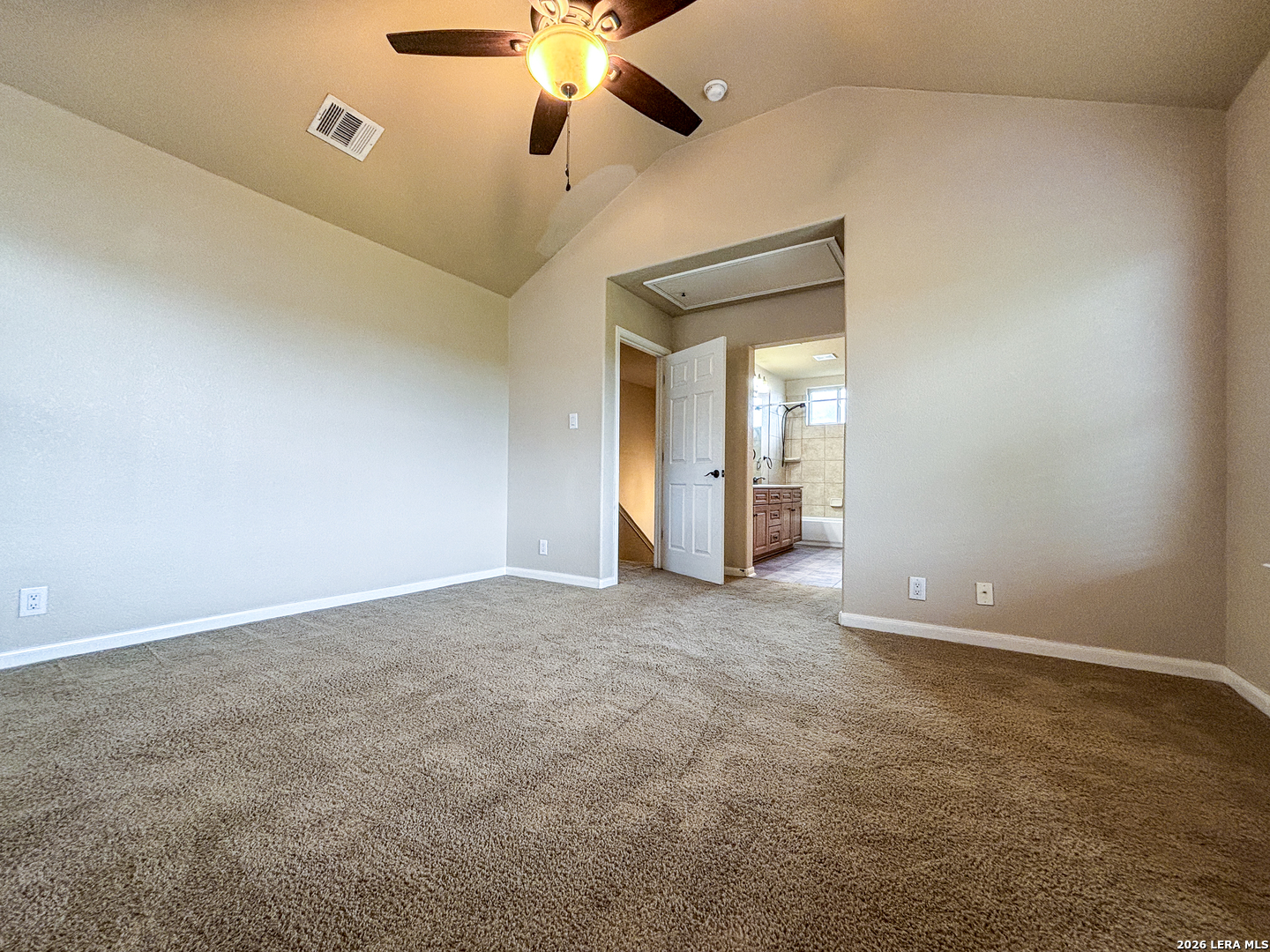 1908 Tanger Terrace New Braunfels, TX 78130 - Photo 15 of 22 an empty room with a ceiling fan and a chandelier fan