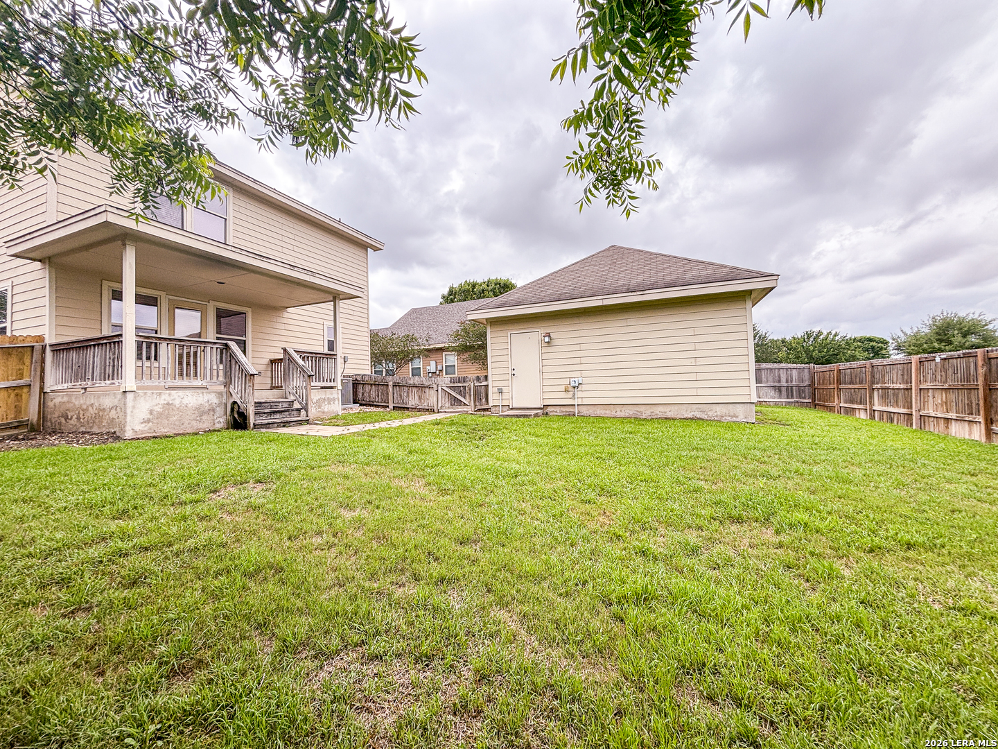 1908 Tanger Terrace New Braunfels, TX 78130 - Photo 22 of 22 a backyard of a house with table and chairs