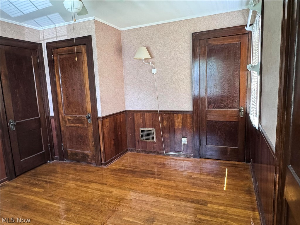 7121 North Lima Road Youngstown, OH 44514 - Photo 29 of 37 Hardwood flooring and paneled walls create a classic interior aesthetic