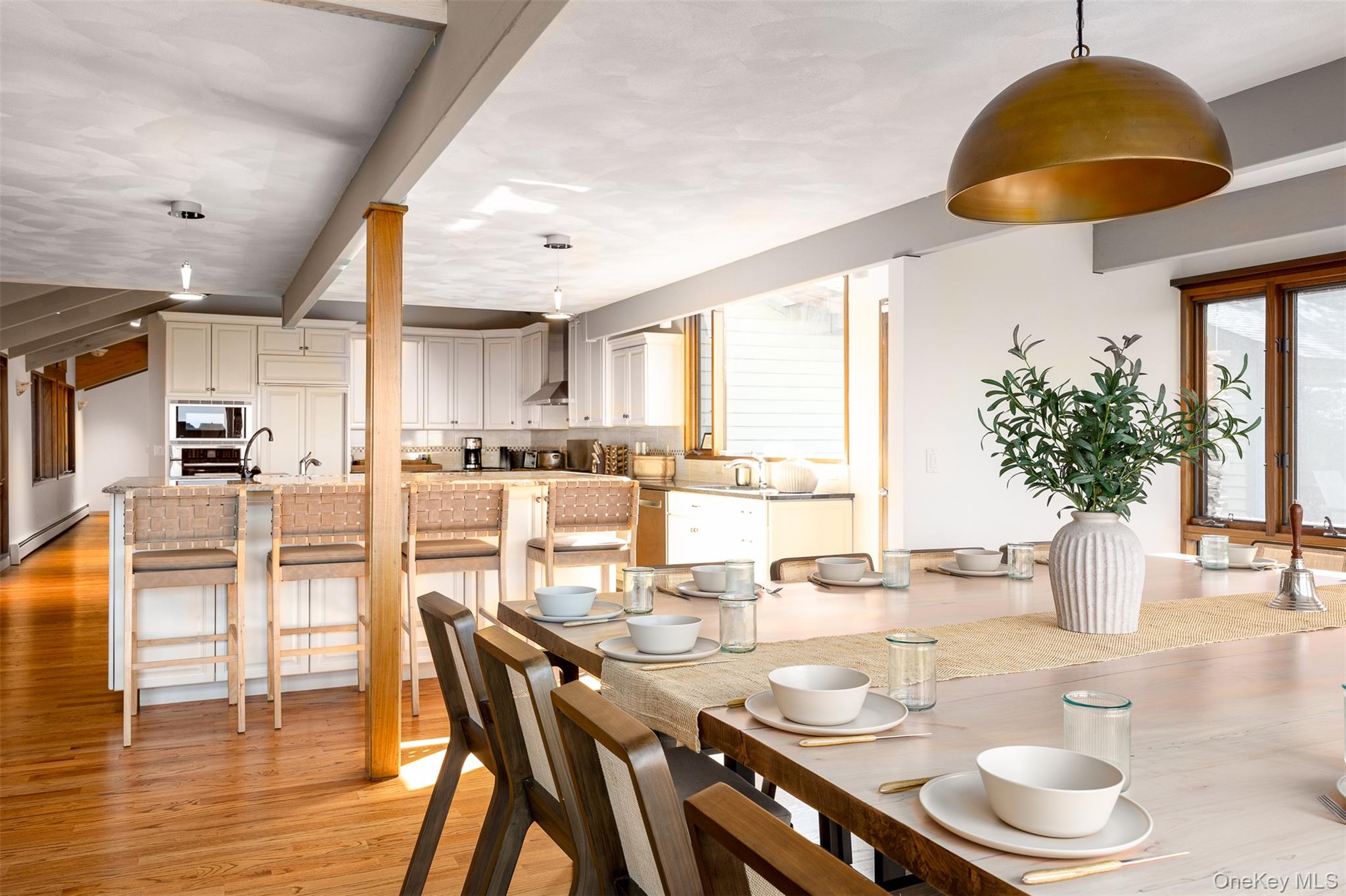 12 Mountain Brook Road Cornwall, NY 12518 - Photo 18 of 50 Dining area featuring light wood finished floors, a baseboard radiator, and beamed ceiling