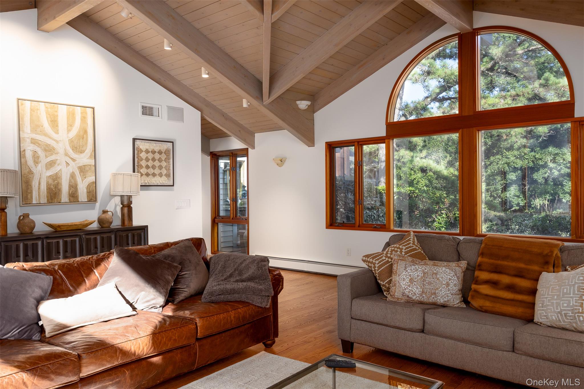 12 Mountain Brook Road Cornwall, NY 12518 - Photo 22 of 50 Living area featuring a wood ceiling with exposed beams, wood finished floors, healthy amount of natural light, high vaulted ceiling, and a baseboard heating unit
