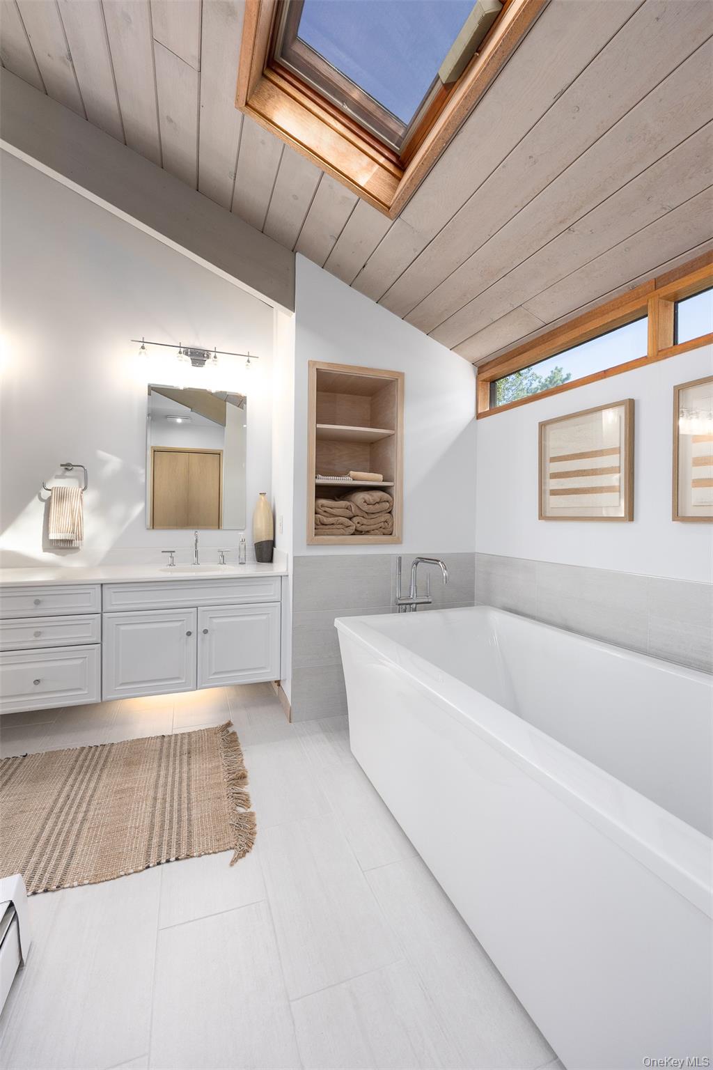 12 Mountain Brook Road Cornwall, NY 12518 - Photo 31 of 50 Bathroom featuring lofted ceiling, wooden ceiling, a freestanding bath, vanity, and a skylight
