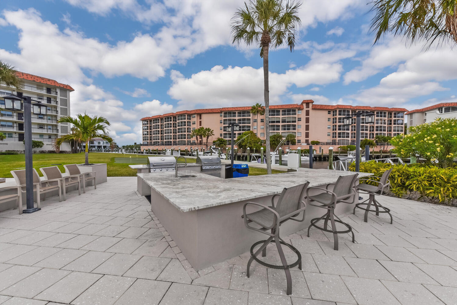 2871 North Ocean Boulevard, Unit F429 Boca Raton, FL 33431 - Photo 27 of 38 a view of swimming pool with outdoor seating and plants