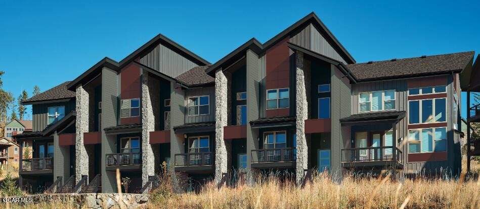 110 River Run Circle Fraser, CO 80442 - Photo 1 of 13 a front view of a house with a yard and balcony
