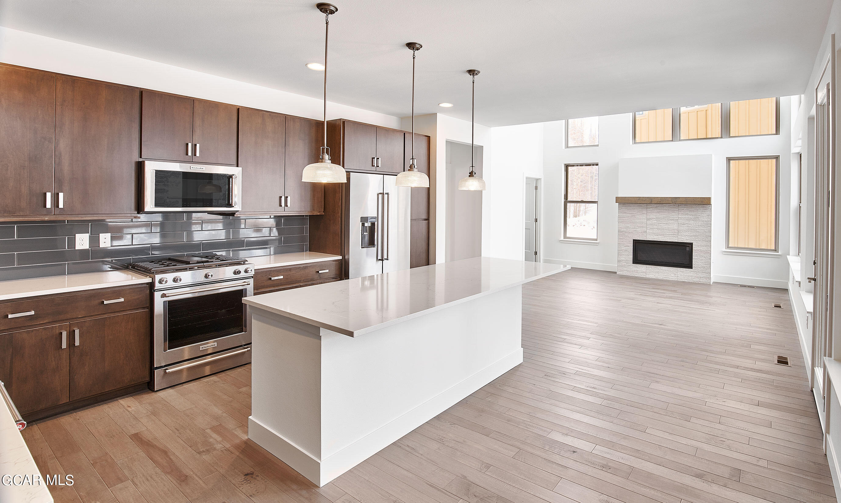 110 River Run Circle Fraser, CO 80442 - Photo 2 of 13 a large kitchen with stainless steel appliances granite countertop a stove a sink and a refrigerator