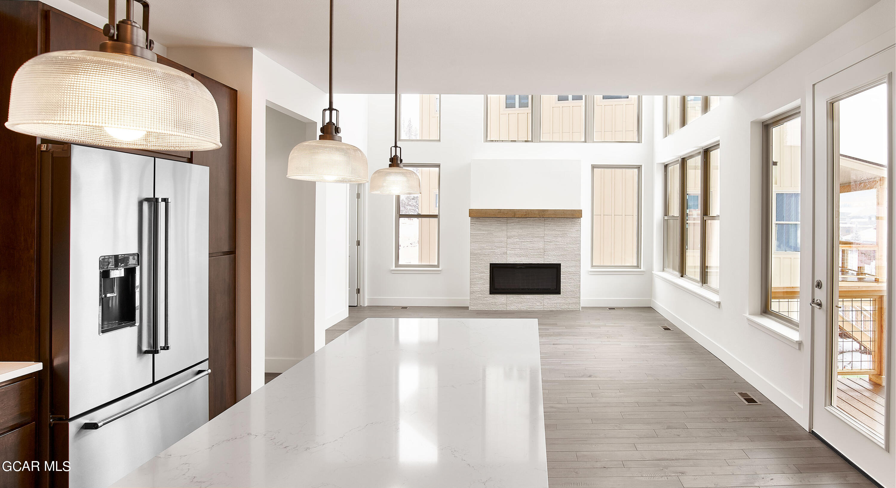 110 River Run Circle Fraser, CO 80442 - Photo 5 of 13 a view of a kitchen with a fireplace and windows