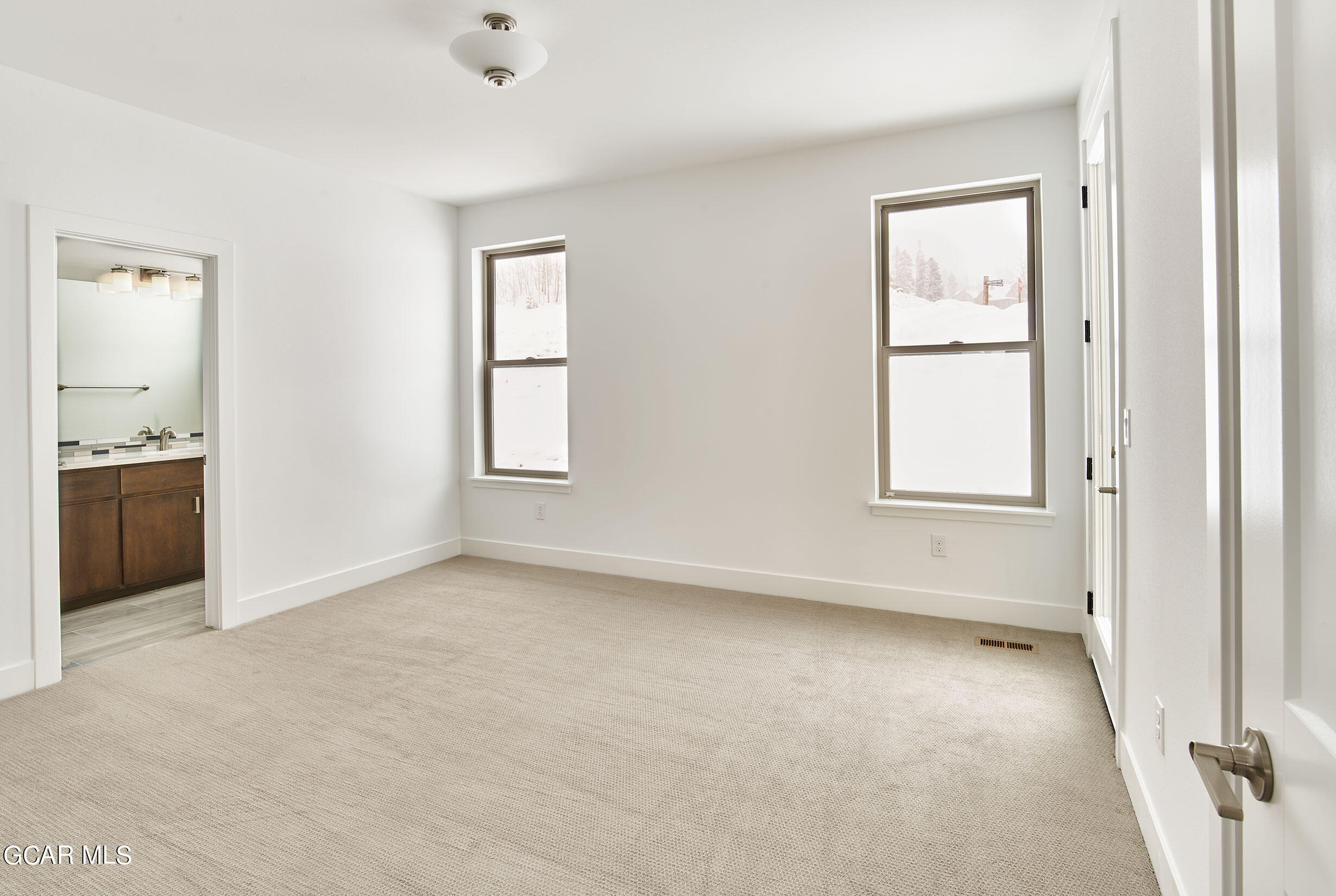 110 River Run Circle Fraser, CO 80442 - Photo 10 of 13 an empty room with windows and closet