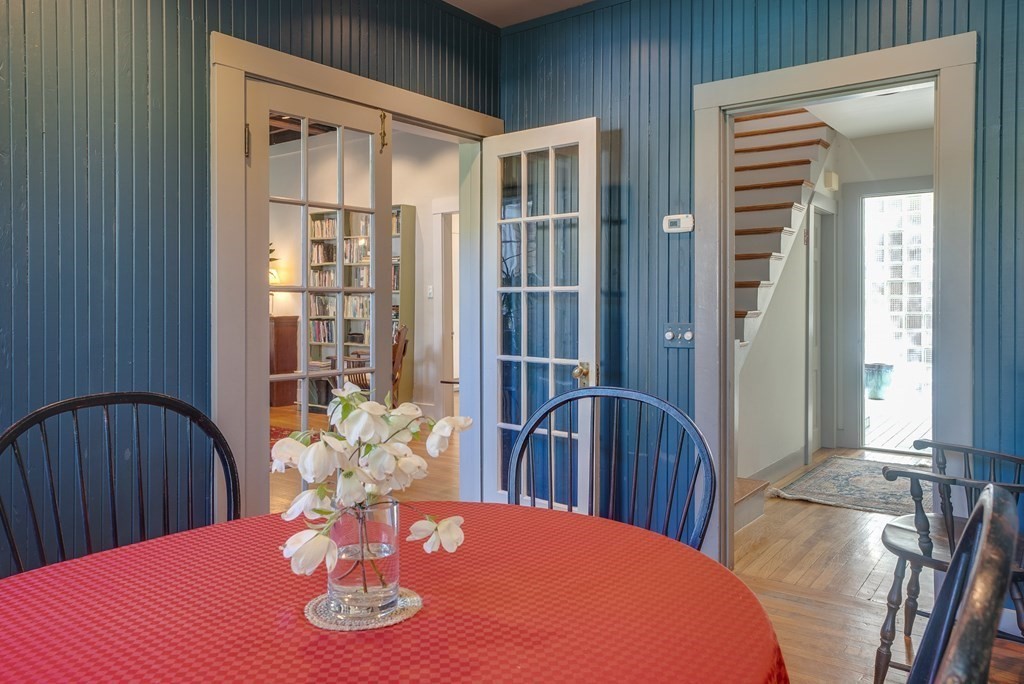 9 Addison Street Arlington, MA 02476 - Photo 11 of 41 a view of a dining room with furniture and wooden floor