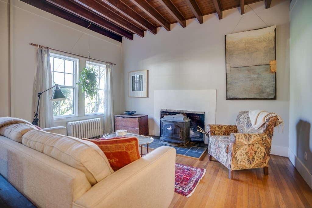 9 Addison Street Arlington, MA 02476 - Photo 13 of 41 a living room with furniture and a fireplace